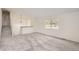 Living room with plush carpeting, a large window, and easy access to the upper level at 1800 Centaur Village Dr, Lafayette, CO 80026