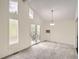 Living room featuring a large window, French doors to the deck, and plush carpet at 1800 Centaur Village Dr, Lafayette, CO 80026