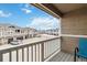 Balcony view featuring well-maintained townhomes and ample parking on a sunny day at 9031 Apache Plume Dr # E, Parker, CO 80134