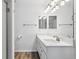 Bright bathroom highlighting a quartz countertop vanity and well-lit mirrors and wall sconces at 9031 Apache Plume Dr # E, Parker, CO 80134