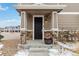 Inviting townhome entryway featuring stone pillars and a charming flower pot at 9031 Apache Plume Dr # E, Parker, CO 80134