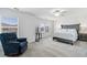 A generously sized main bedroom showcasing dual windows and neutral walls and carpet at 9031 Apache Plume Dr # E, Parker, CO 80134