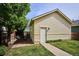 Charming backyard with private patio, walkway, lawn, and landscaping at 10671 E 28Th Ave, Denver, CO 80238