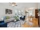 Bright, open living room with hardwood floors, modern decor, and ample natural light at 10671 E 28Th Ave, Denver, CO 80238