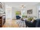 Bright living room with wood floors and a modern fireplace at 10671 E 28Th Ave, Denver, CO 80238