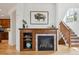 A living room features a fireplace with a wood mantle and a bison art piece at 10671 E 28Th Ave, Denver, CO 80238