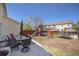 Backyard featuring a patio, dining table, and play area at 817 Pintail Ave, Brighton, CO 80601