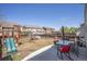 Backyard with a play structure, patio, and outdoor dining space at 817 Pintail Ave, Brighton, CO 80601