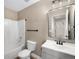 Bathroom with a vanity, mirror, toilet, and tub/shower combo at 817 Pintail Ave, Brighton, CO 80601