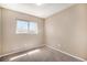 Cozy bedroom featuring carpet and a sunlit window view at 817 Pintail Ave, Brighton, CO 80601