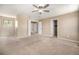 Spacious bedroom with neutral paint, carpet, and multiple doorways at 817 Pintail Ave, Brighton, CO 80601