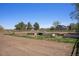 Community garden with raised beds, fertile soil, and a serene, rural ambiance at 817 Pintail Ave, Brighton, CO 80601