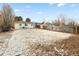 Backyard features ample space for outdoor activities, surrounded by a wooden fence for privacy at 1920 Ulster St, Denver, CO 80220