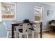Dining area featuring seating for four under two windows, complemented by neutral wall color at 1920 Ulster St, Denver, CO 80220