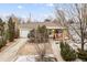Charming home with a well-maintained front yard, a detached garage, and a welcoming entrance at 1920 Ulster St, Denver, CO 80220
