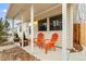 Inviting front porch with orange chairs, perfect for relaxing outdoors at 1920 Ulster St, Denver, CO 80220