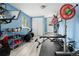 Home gym featuring weights and exercise equipment on light grey wood look floors at 1920 Ulster St, Denver, CO 80220