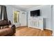 Cozy living room with hardwood floors, modern furnishings, and plenty of natural light at 1920 Ulster St, Denver, CO 80220