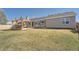 Spacious backyard with a wooden pergola and lush green grass, perfect for outdoor activities at 21585 E Powers Cir, Centennial, CO 80015