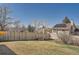Backyard featuring a wooden fence for privacy and a hammock for relaxation at 21585 E Powers Cir, Centennial, CO 80015