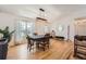 Dining room featuring hardwood floors, natural light, and a simple table setting at 21585 E Powers Cir, Centennial, CO 80015