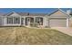 Charming ranch style home with stone accents, gray siding, and a well-maintained lawn at 21585 E Powers Cir, Centennial, CO 80015