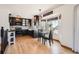 Cozy kitchen with black cabinetry, stainless steel appliances, and bright breakfast nook at 21585 E Powers Cir, Centennial, CO 80015