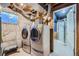 Basement laundry room with washer and dryer, and a view into the bathroom at 21585 E Powers Cir, Centennial, CO 80015