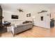 Bright living room featuring a stone fireplace, hardwood floors, and ample seating at 21585 E Powers Cir, Centennial, CO 80015