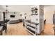 Bright open-concept living room featuring hardwood floors and neutral tones at 21585 E Powers Cir, Centennial, CO 80015