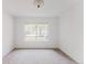 Bright bedroom with neutral carpet and a large window at 2727 Folsom St # 210, Boulder, CO 80304