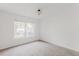 Well-lit bedroom with plush carpeting and large window at 2727 Folsom St # 210, Boulder, CO 80304