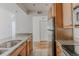 Bright kitchen features granite countertops, stainless steel appliances, and wood cabinets at 2727 Folsom St # 210, Boulder, CO 80304