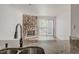 Living area view showcases kitchen details, stone fireplace, and sliding door to balcony at 2727 Folsom St # 210, Boulder, CO 80304