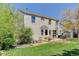 Expansive backyard with a patio, fire pit, lush lawn, mature trees offering privacy and outdoor enjoyment at 15432 Greenstone Cir, Parker, CO 80134