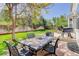 Spacious backyard featuring a large patio with an outdoor dining set, perfect for entertaining and relaxation at 15432 Greenstone Cir, Parker, CO 80134