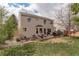 Spacious backyard with patio, perfect for entertaining, featuring lush grass and a fire pit area at 15432 Greenstone Cir, Parker, CO 80134
