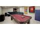 Basement with a pool table, dark green sofa, and wall decor at 15432 Greenstone Cir, Parker, CO 80134