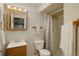Bathroom featuring a vanity, toilet, shower, and neutral tones at 15432 Greenstone Cir, Parker, CO 80134