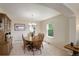 Dining area with wood table and chairs, natural light, and adjacent to kitchen at 15432 Greenstone Cir, Parker, CO 80134