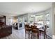 Open concept dining area features hardwood floors and access to the living room and backyard at 15432 Greenstone Cir, Parker, CO 80134