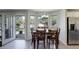 Eat-in dining room featuring a wood table, ample natural light, and views of the backyard at 15432 Greenstone Cir, Parker, CO 80134