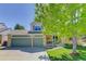 Charming two-story home with a three-car garage and beautiful landscaping in a suburban neighborhood at 15432 Greenstone Cir, Parker, CO 80134