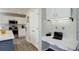 A convenient home office space with white desk, with access to the kitchen area at 15432 Greenstone Cir, Parker, CO 80134