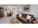 Living area with a dining table and chairs in the background, a sofa and a wooden cabinet at 15432 Greenstone Cir, Parker, CO 80134