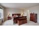 Main bedroom with bedside tables, chest, and a large window offering natural light at 15432 Greenstone Cir, Parker, CO 80134