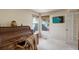 Cozy office with an antique roll-top desk and natural light streaming through the windows at 15432 Greenstone Cir, Parker, CO 80134