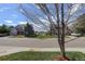 A picturesque street view captures well-maintained homes with lush green lawns under a bright sky at 15432 Greenstone Cir, Parker, CO 80134