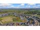 Aerial view showcases the home, park, and community pool within a picturesque neighborhood setting at 113 Marlowe Dr, Erie, CO 80516