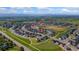 Scenic aerial view featuring the neighborhood, community pool, park, and 113 Marlowe Dr at 113 Marlowe Dr, Erie, CO 80516